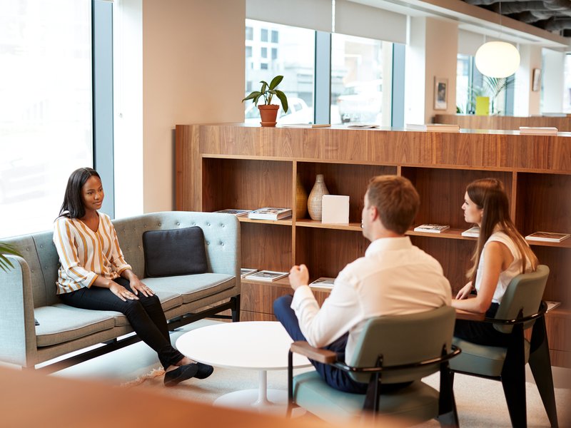 Launch Point Marketing team members in a one-on-one mentorship conversation
